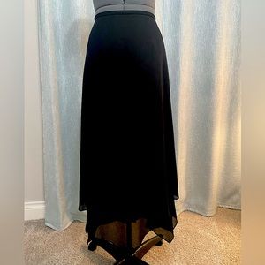Black long asymmetrical skirt. Size 4.